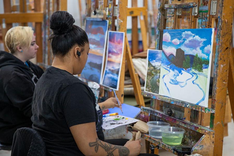 San Juan College students painting landscapes